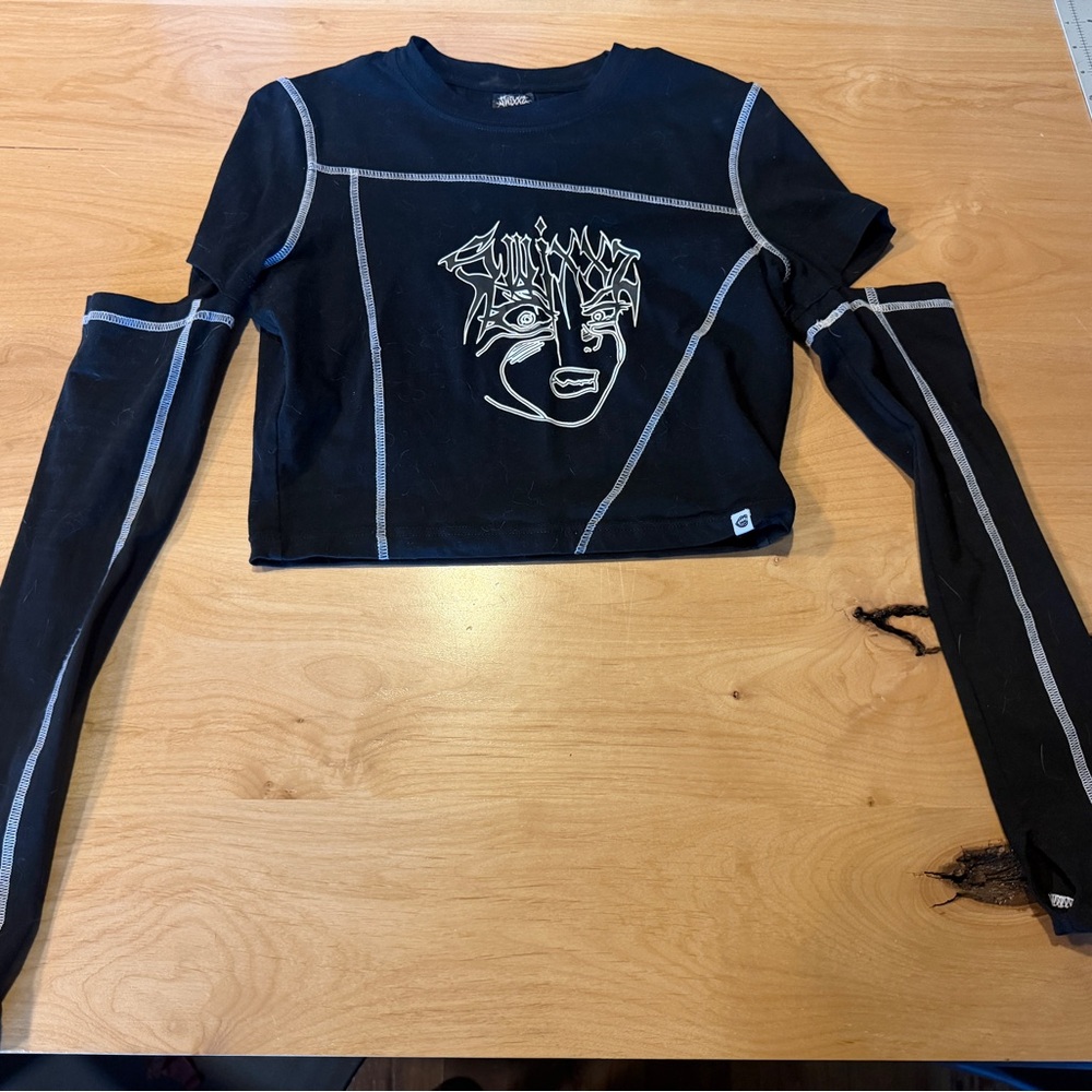 SWIXXZ Crop Long Sleeve Top with Graphic Face and Contrast Stitching